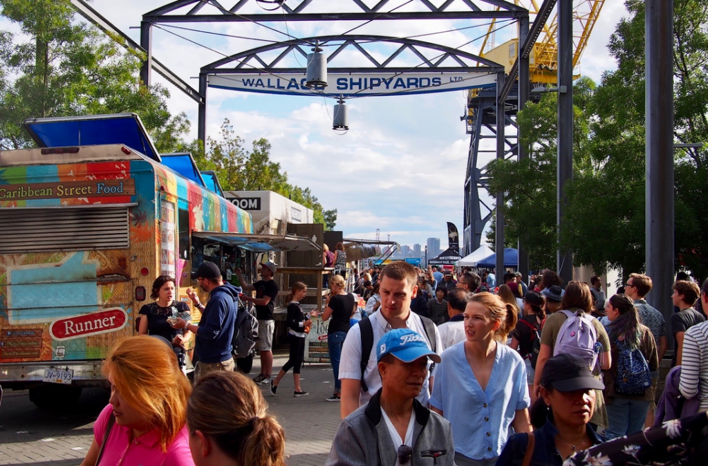 Crowds of People Eating Food from Trucks at Shipyards Night Market North Vancouver
